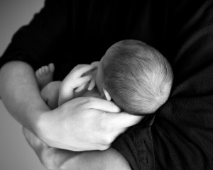 black and white baby being held image