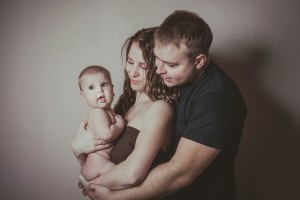 family holding baby
